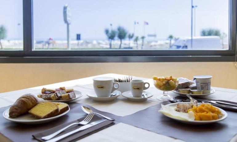 Seaside breakfast: pastries, fruit, and coffee in a relaxing atmosphere.